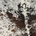 Closeup of this XL, Tricolor, Speckled, Brazilian Cowhide, showing white with dark brown and black spots and speckles (BRSP1707)