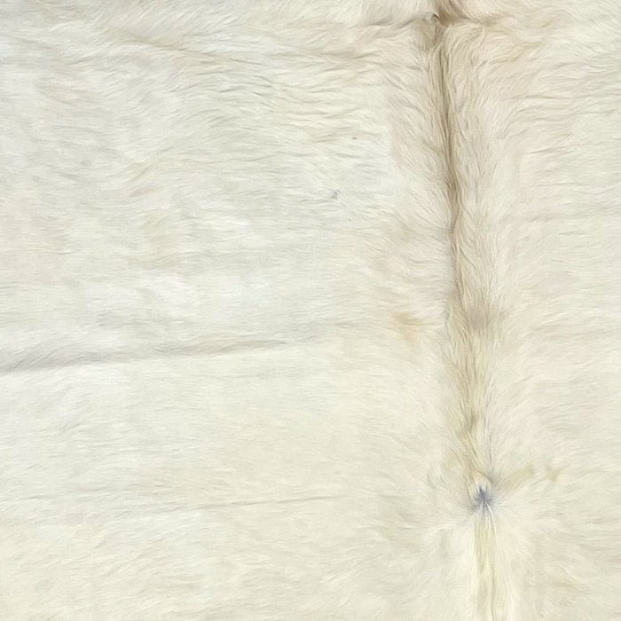 Closeup of this Large, Solid Off-White, Brazilian Cowhide, with longer hair on the spine - 7'9" x 5'11" (BRWT036)
