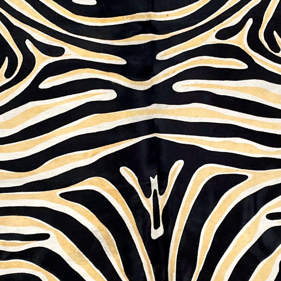 Closeup of this Large, Off-White, Brazilian Cowhide that has been stenciled w/ a black and yellow, Zebra Print (BRZP030)