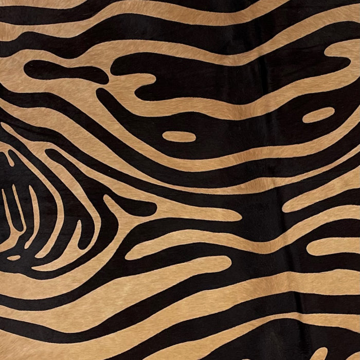 Closeup of this Brown, Brazilian Cowhide, showing a black, zebra print (BRZP036)