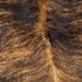 Closeup of this Colombian, Brindle Cowhide, showing black and golden brown (COBR956)