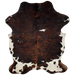 Colombian Tricolor Cowhide:  has a black and brown, brindle pattern, with a few small, white spots, and white with black and brown spots on the belly and hind shanks - 7'2" x 5' (COTR726)