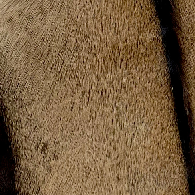 Closeup of this Goatskin that is brown with a strip of dark chocolate down the middle and along the side edges (GOAT124)