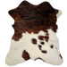 Tricolor Mini Cowhide:  brown and black brindle pattern across the top half of the hide, and white with small, brown and black spots on the lower half - 2'8" x 2'3" (MINI176)