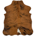 XS Brown and Black Brindle Cowhide:  brown with black, brindle markings, and one white spot in the middle, near the lower edge - 4'5" x 3'5" (XS166)